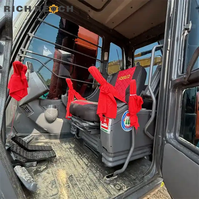 Used Hitachi ZAXIS 120 excavator – loading dump truck at job site