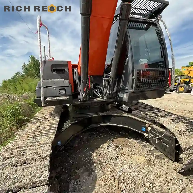 Cab interior seat and joysticks of a used Hitachi ZAXIS 240 excavator