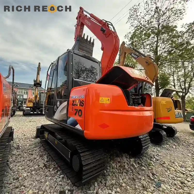 Arm cylinder rod and hose routing on a used Hitachi ZAXIS 70 excavator with low hours, priced in USD