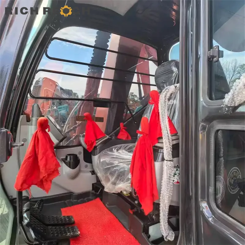 Used Hitachi ZAXIS 70 excavator backfilling a ditch, low hour machine priced in USD
