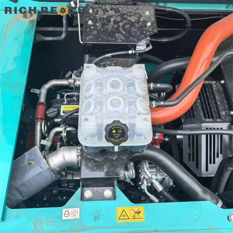 Mitsubishi 6D34 engine compartment of used Kobelco SK200 excavator, well-maintained low hours