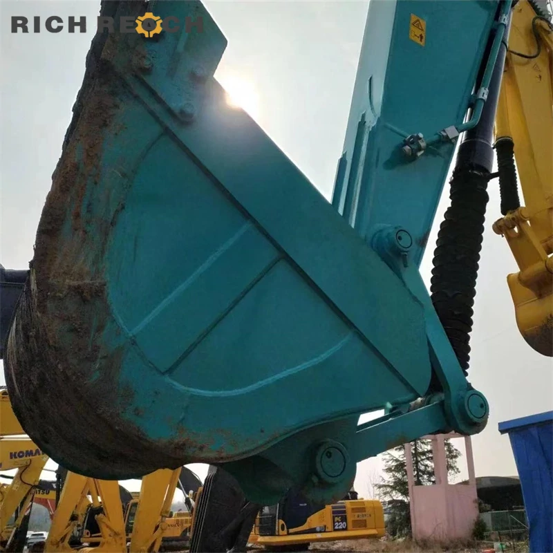 Standard front boom and arm assembly of used Kobelco 200 excavator for sale, priced in USD