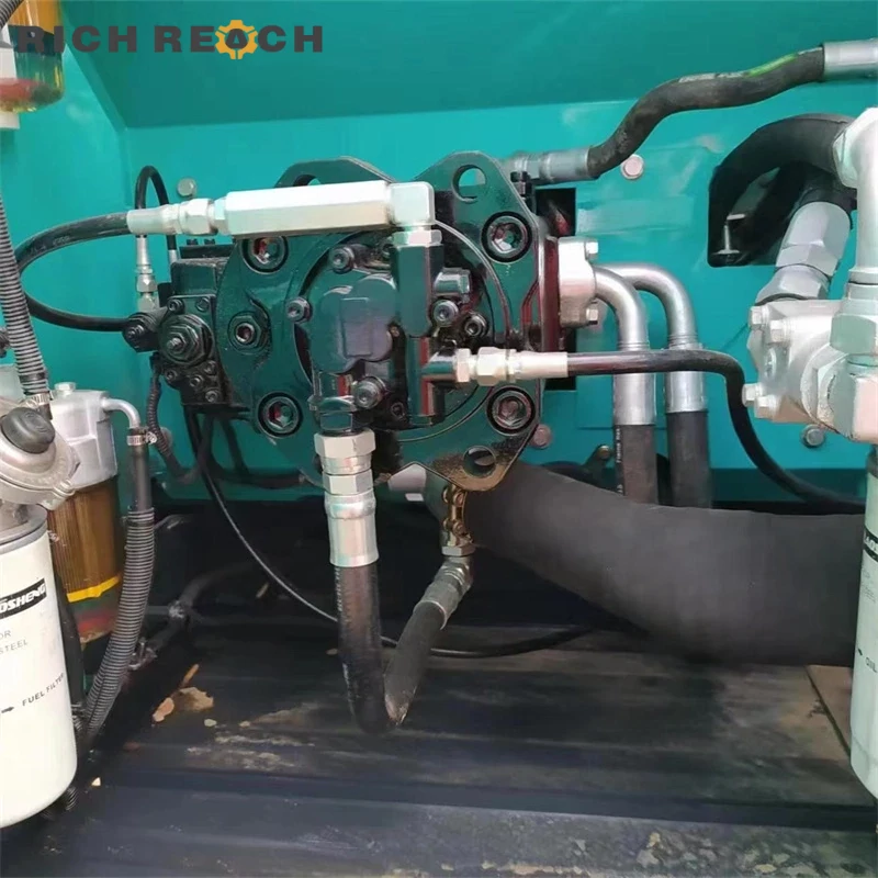 Right side hydraulic pump room and main valves on used Kobelco 200 excavator