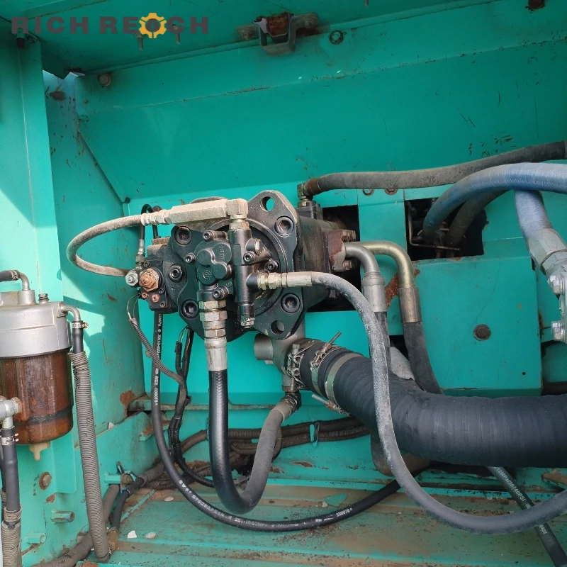 Hino J05E engine compartment of a used Kobelco 250 crawler excavator, low maintenance hours, great value second-hand machine priced in USD