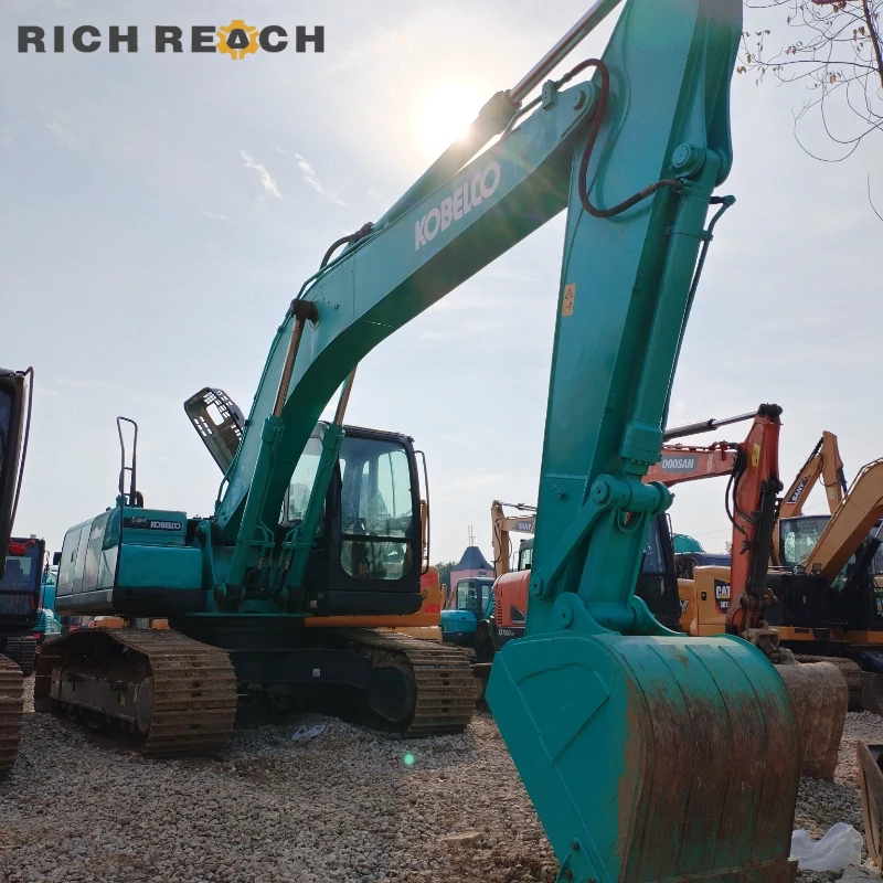 Left side HD undercarriage and track chain of a used Kobelco SK250 crawler excavator, low wear percentage, priced in USD