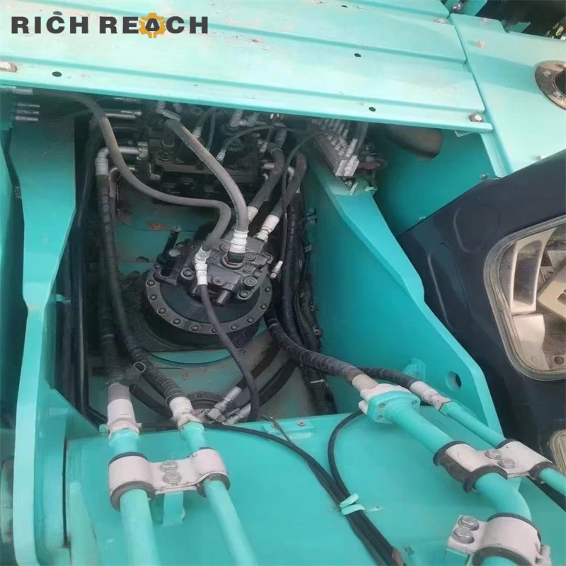 Cab interior and LCD monitor of a used Kobelco 260D excavator, low hour unit priced in USD