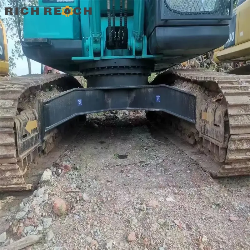 Right side pump and valve access on a used Kobelco 260D excavator for sale, low hours verified