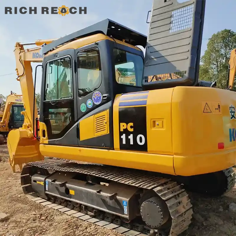 Front standard boom and arm of a used Komatsu PC110 excavator, low hours, excellent condition