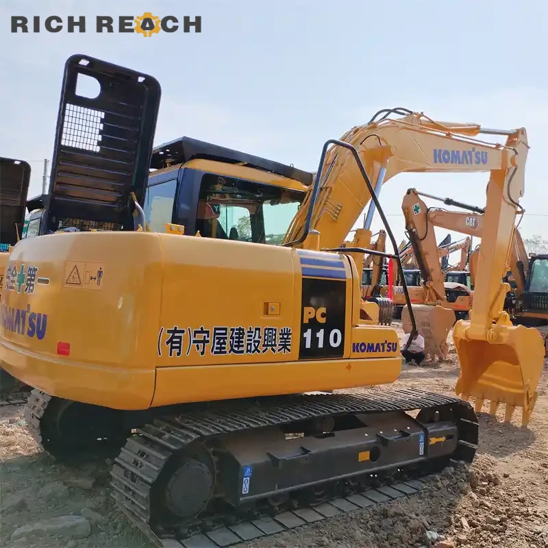 Rear counterweight of a used Komatsu PC110 excavator, low hours, priced in USD, ready for sale