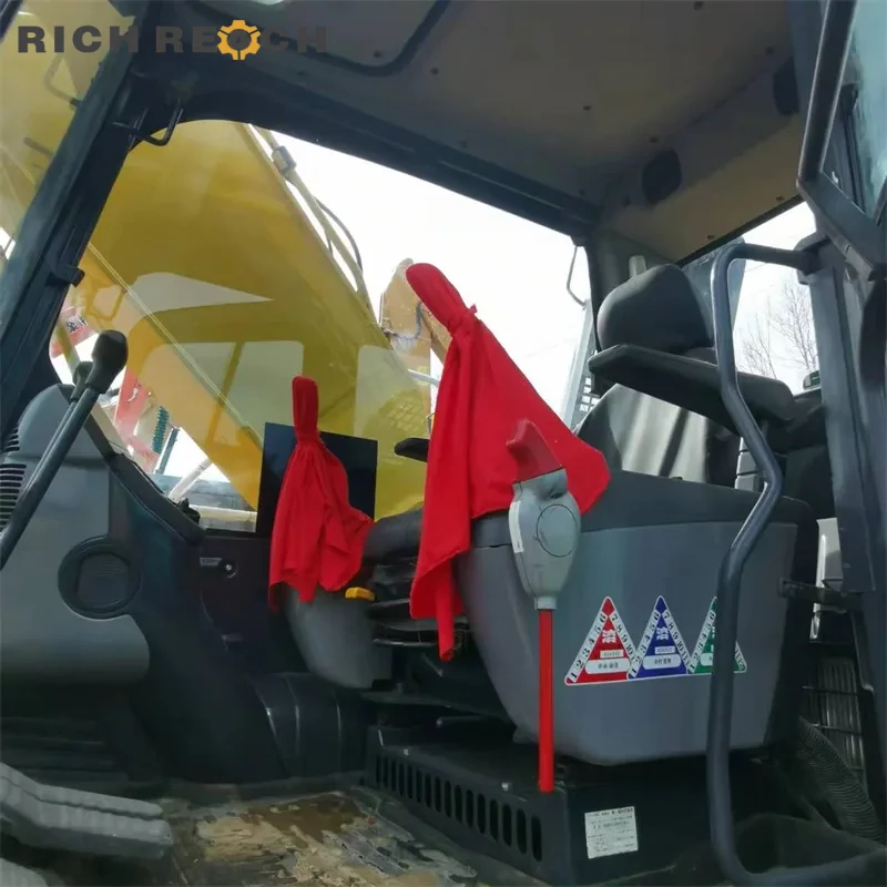 Bucket linkage and wear plates on a used Komatsu PC200 excavator