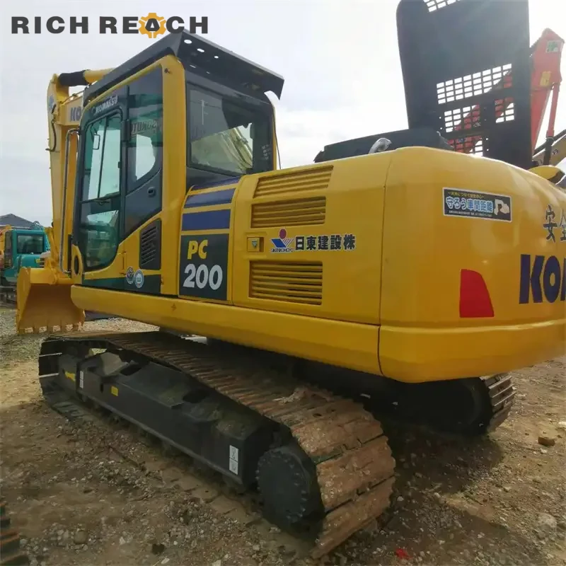 Bucket teeth and side cutters of a used Komatsu PC200 crawler excavator