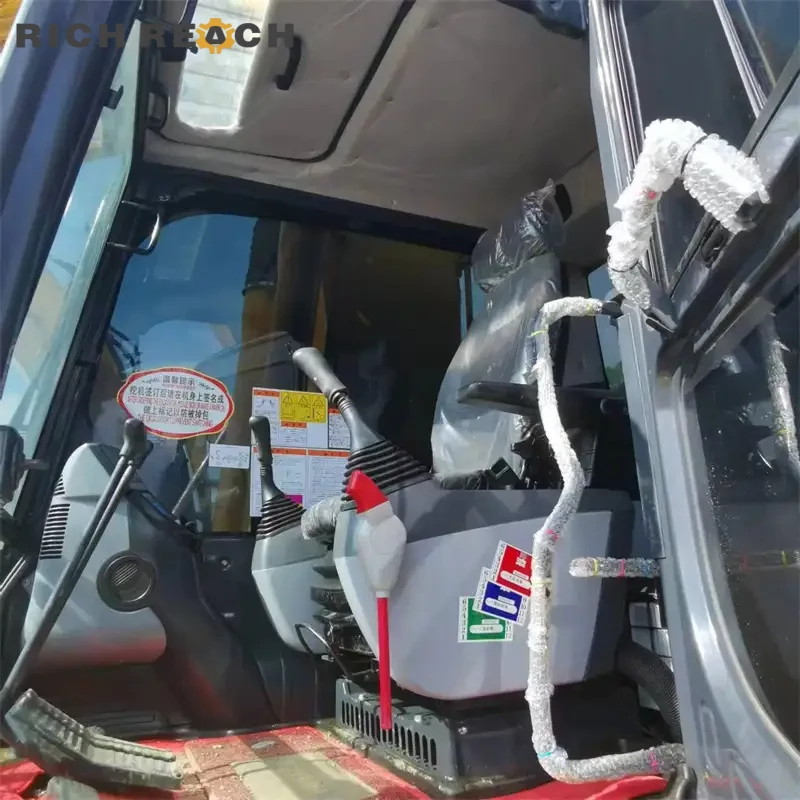 Engine bay, turbocharger, and intake piping of a used Komatsu PC200