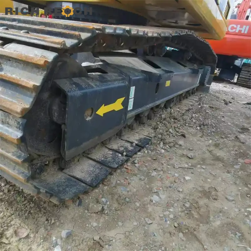 Exhaust stack and muffler on a used Komatsu PC200 crawler excavator