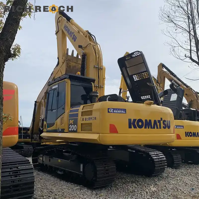 Hydraulic pump and filter bank of a used Komatsu PC200 excavator