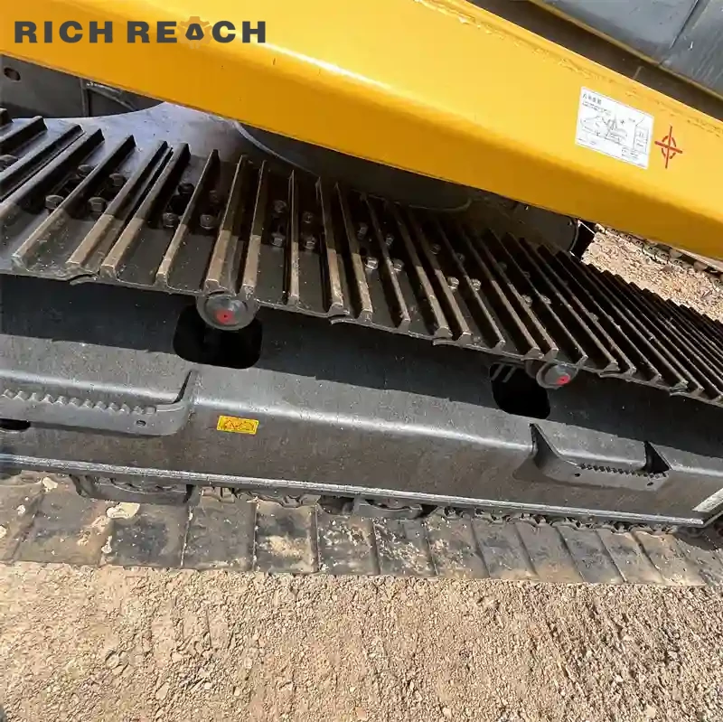 Engine compartment of a used Komatsu PC220 excavator for sale