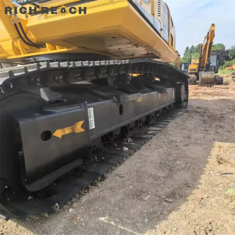 Used Komatsu PC220 excavator working on pond excavation