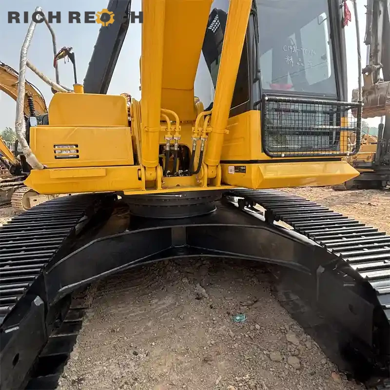 Front three-quarter view of a used Komatsu PC220 excavator for sale