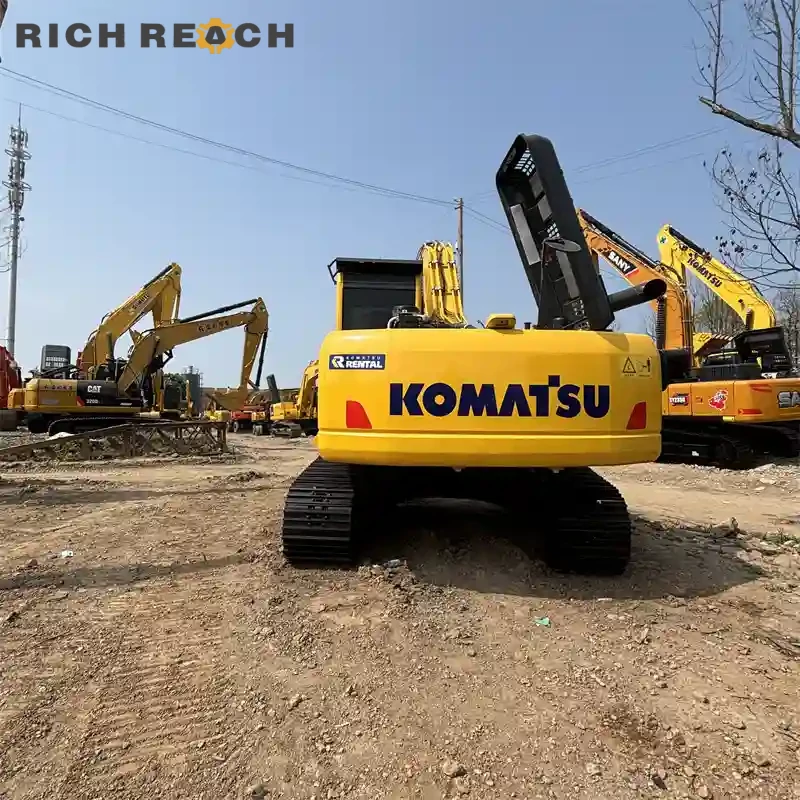 Left side view with boom lowered on a used Komatsu PC220 excavator