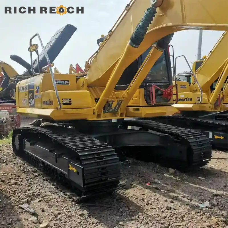 Left side long track view of a used Komatsu PC220 excavator for sale