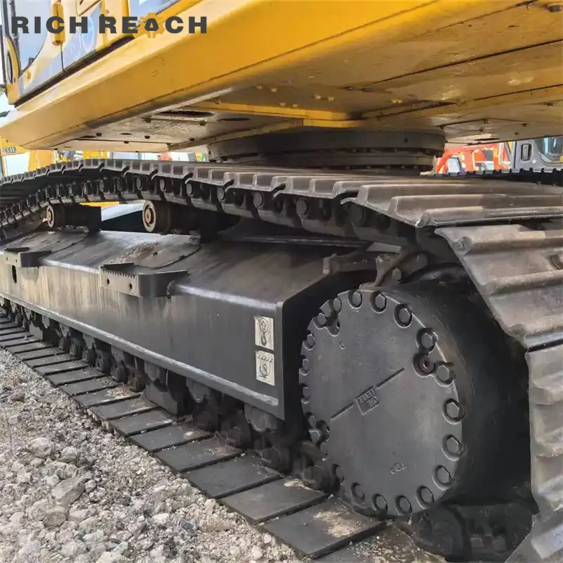 Left side heavy-duty track frame, track links and final drive of a low-hour used Komatsu PC240