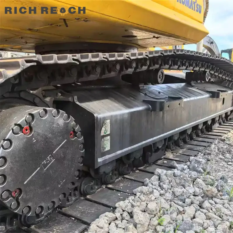 Rear counterweight and engine access doors of a used Komatsu PC240 excavator built for durability