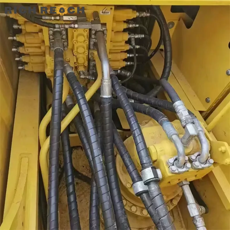 Cab interior with original monitor, seat and joysticks of a used Komatsu PC240LC excavator