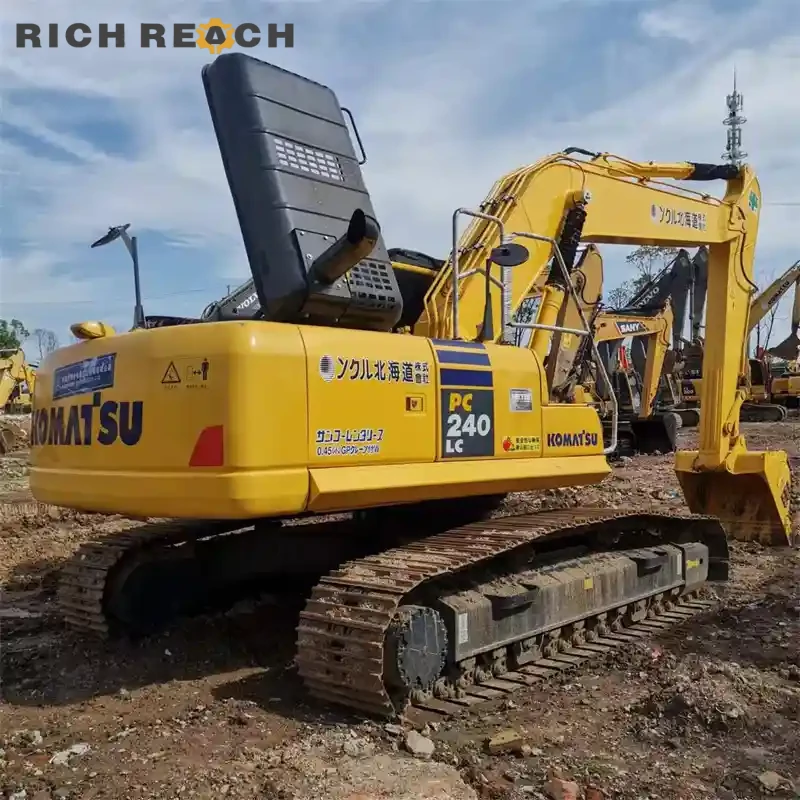 Engine bay with turbocharger and piping of a used Komatsu PC240LC excavator (low hours)