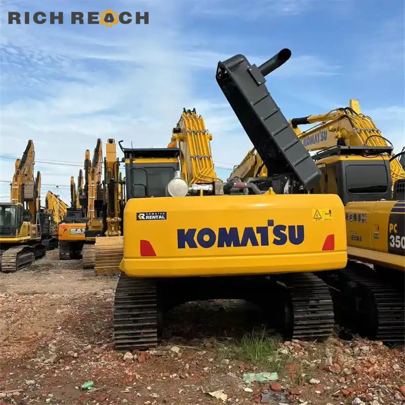 Engine bay turbo and piping of a used Komatsu PC350 excavator for sale