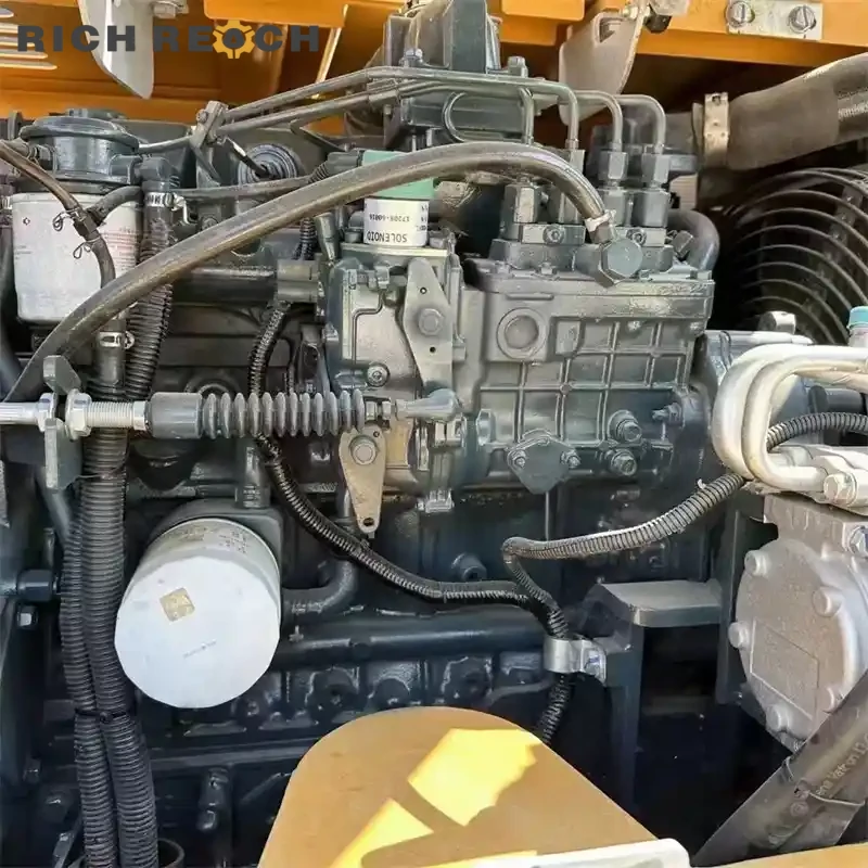Undercarriage and rubber tracks of a used Komatsu PC35MR mini excavator – low hours, compact and powerful