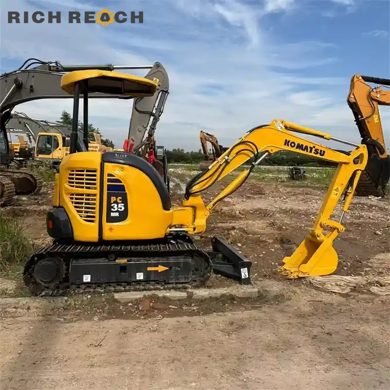 Engine compartment and Komatsu 3D88E-6 diesel engine on a used Komatsu PC35MR mini excavator