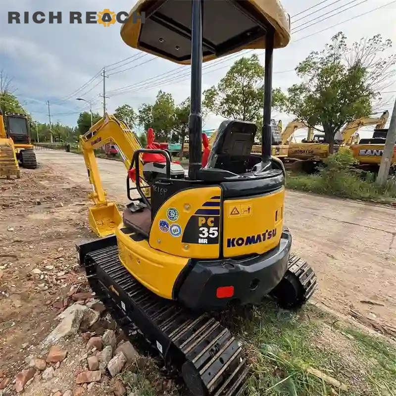 Right side tool box and access panel on a used Komatsu PC35MR mini excavator
