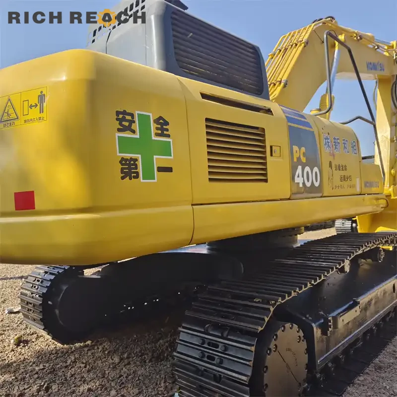 Undercarriage and track chains of a used Komatsu PC400 excavator, low hours, top condition, priced in USD