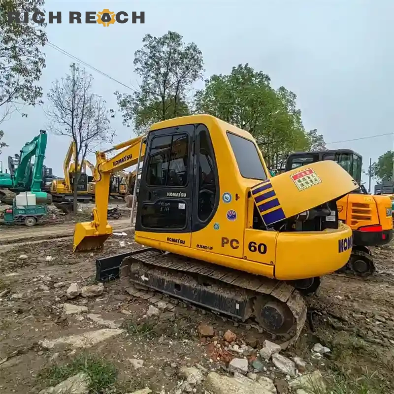 Comfortable cab interior with joysticks and seat of a used Komatsu PC60 excavator