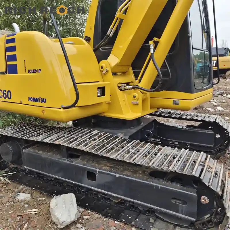 Front canopy and blade assembly of a used Komatsu PC60 excavator for landscaping