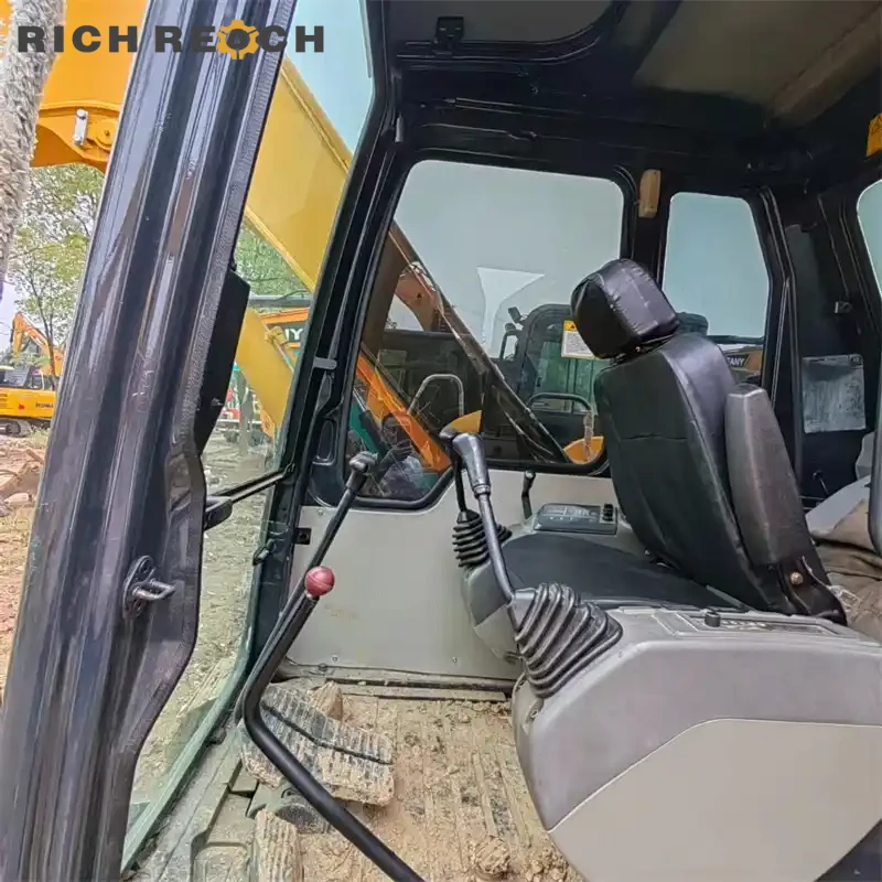 Left side view with rubber tracks of a used Komatsu PC60 excavator – low hours