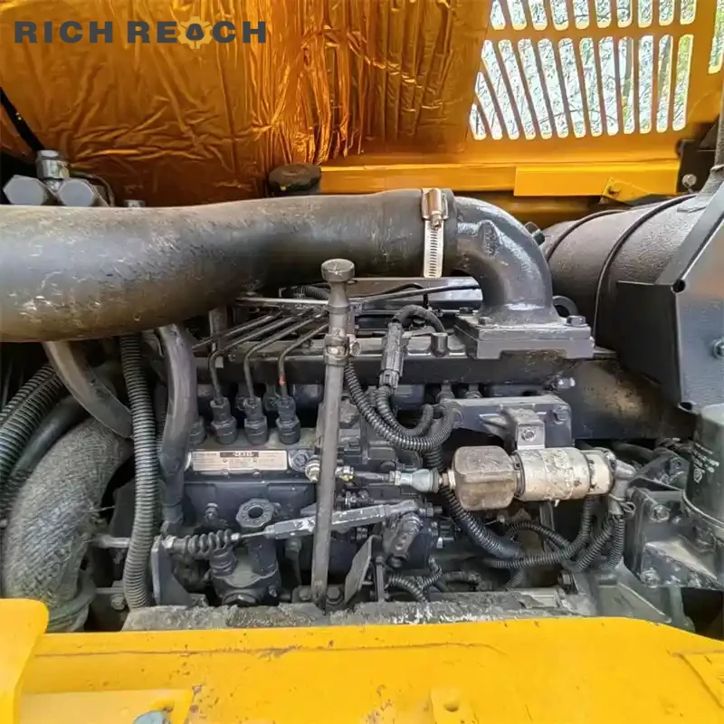 Rear engine grille and counterweight of a used Komatsu PC60 excavator
