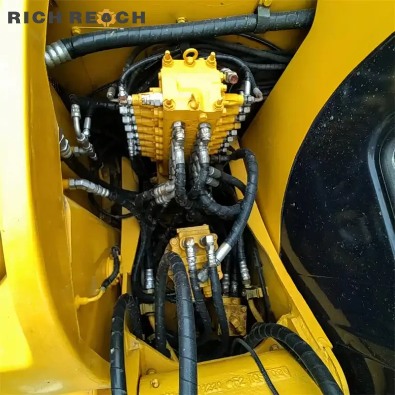 Simple instrument panel and control levers inside a used Komatsu PC60 excavator