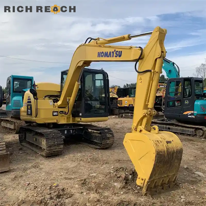 Control panel and throttle of a used Komatsu PC70 mini excavator for sale