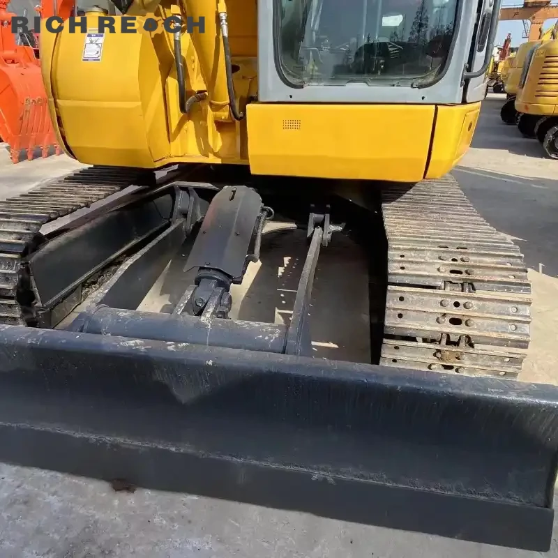Used Komatsu PC78 excavator loading a trailer – ready for work, priced in USD