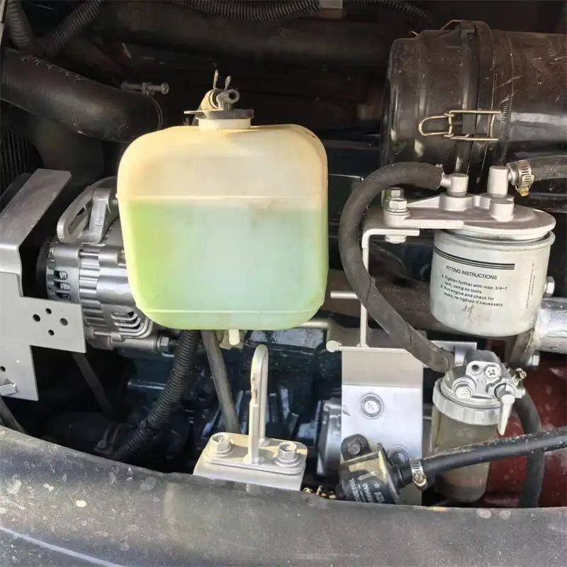 Engine compartment and Kubota D902 diesel engine of a used Kubota 30 mini excavator for sale – low hours, landscaping ready