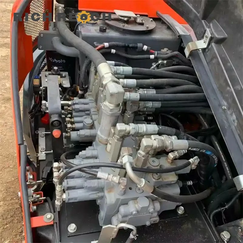 Left side blade lowered on used Kubota U48-4 zero tail swing excavator