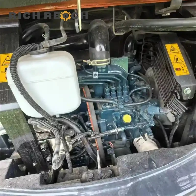 ROPS cab and seat belt of a used Kubota 155 crawler excavator with low tail swing design