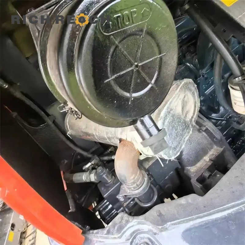 Engine compartment of a Used Kubota 155 excavator – well-maintained diesel engine ready for heavy duty work