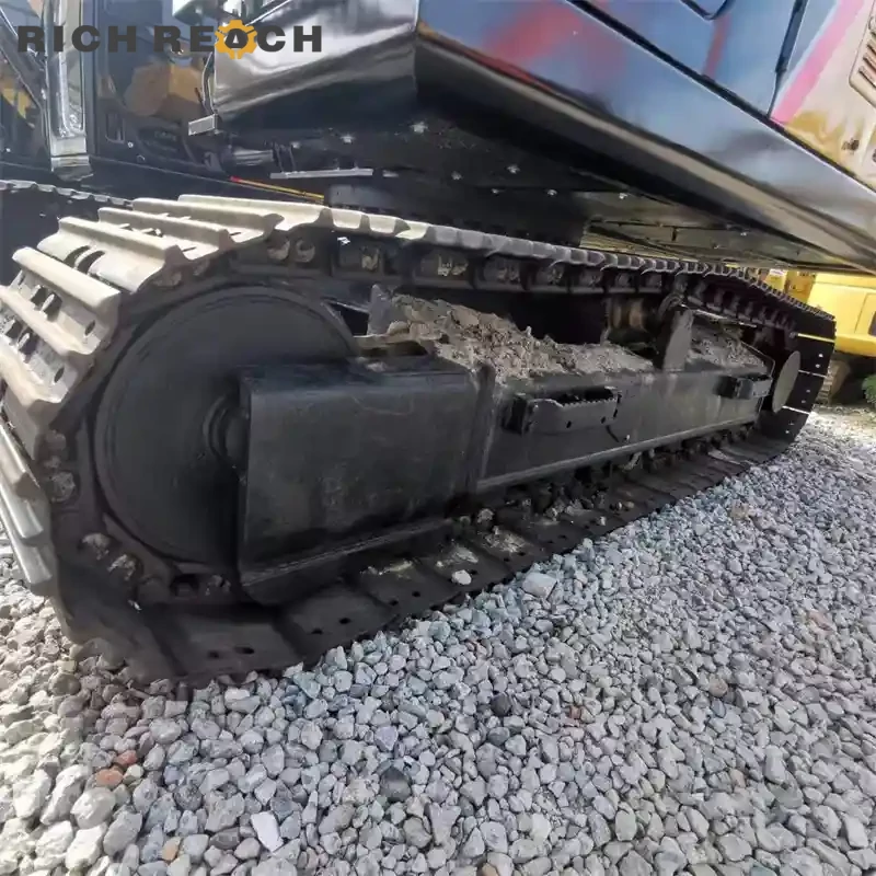 Undercarriage and heavy-duty tracks of a used Sany 125C crawler excavator for sale, robust and low-wear