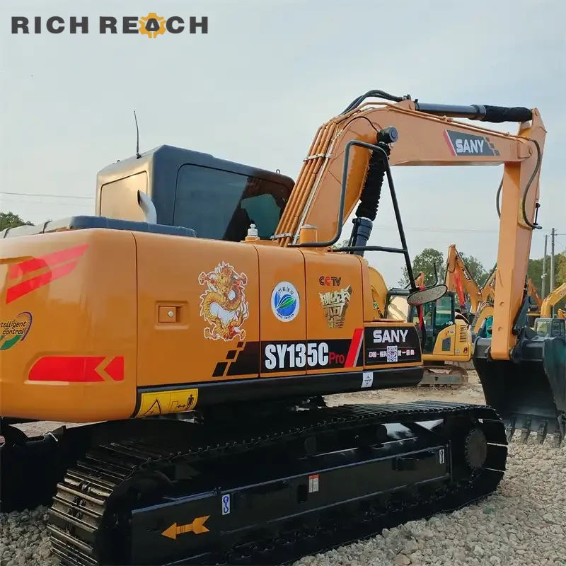 Used Sany 135C Pro excavator loading a dump truck on job site