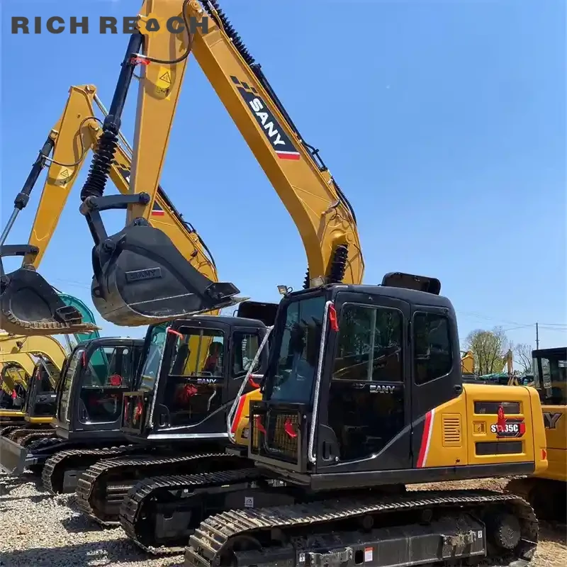 Greasing boom pins on a used Sany 135C excavator