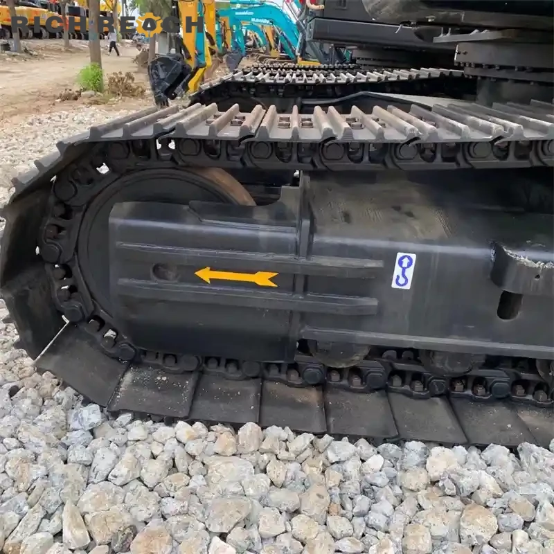 Long undercarriage and track frame of a used Sany 215C Pro crawler excavator