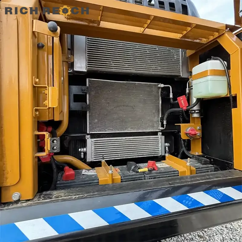 Pilot joysticks and armrest controls of used Sany 245H excavator with verified low hours
