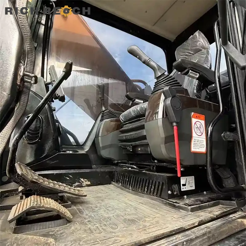 Used Sany 550H excavator front three-quarter view, heavy duty boom and arm, ready to work