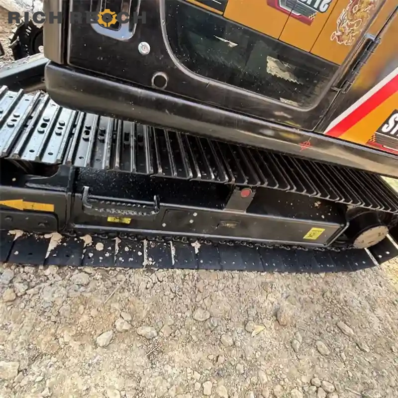 Arm cylinder rod and grease fittings on a used Sany 75C crawler excavator, low hours, excellent working order